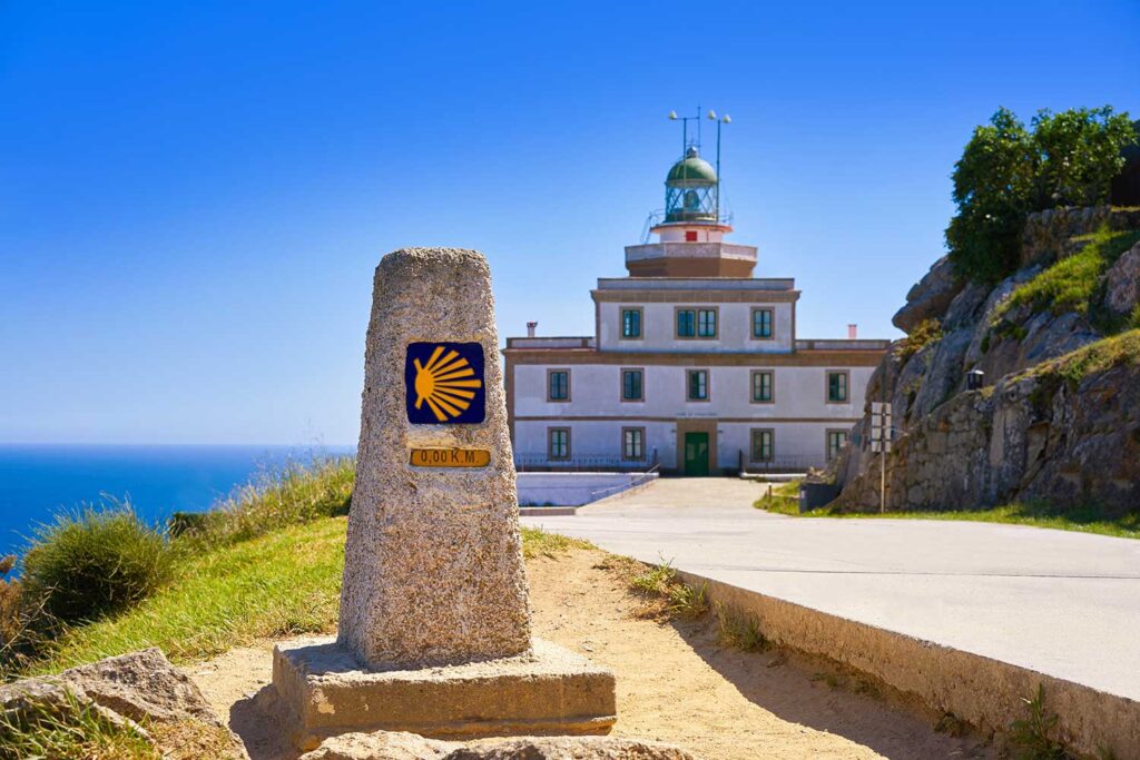 Saint James Way Sign And Lighthouse Of Finisterre